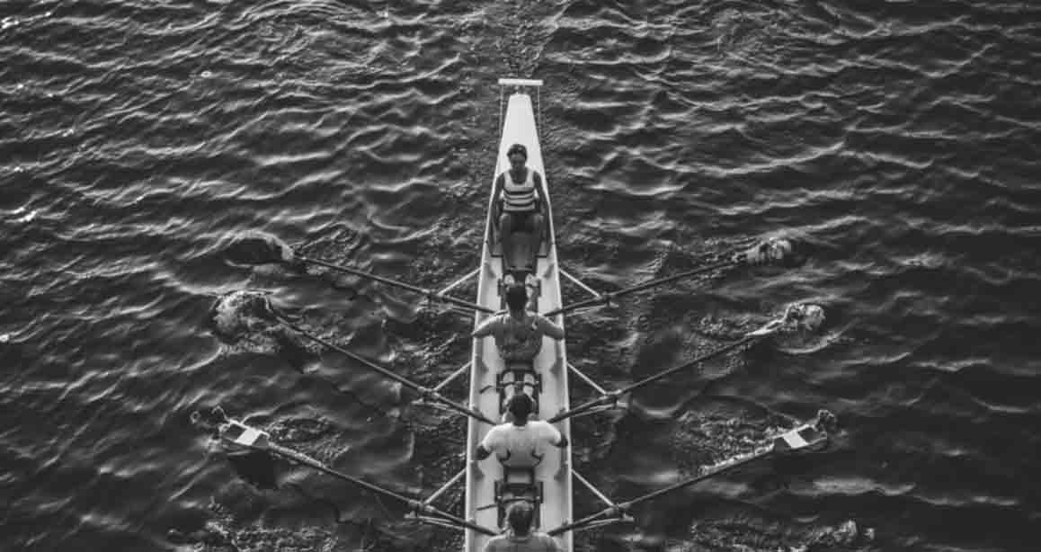 Black and white image of a crew team.